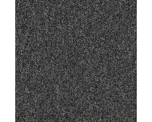 Närbild av en mörk matta med melerad textur.