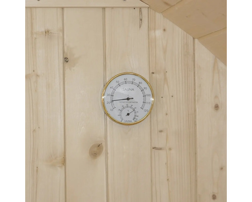 Bastutermometer och hygrometer på en trävägg