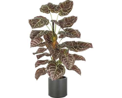 Konstgjord krukväxt i kruka med mönstrade blad.