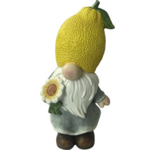 Trädgårdstomte med citronhatt och solros