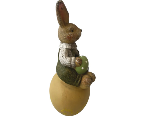 Påskhare på ägg med dekorativt ägg