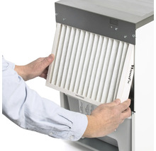 Insättning av ett Woods luftfilter i en luftkonditionering