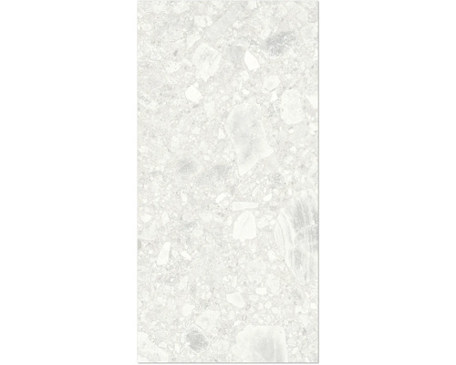 Närbild av en golvplatta med terrazzo-utseende.