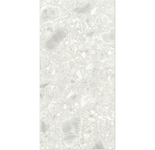 Detaljbild av en golvplatta med terrazzo-utseende