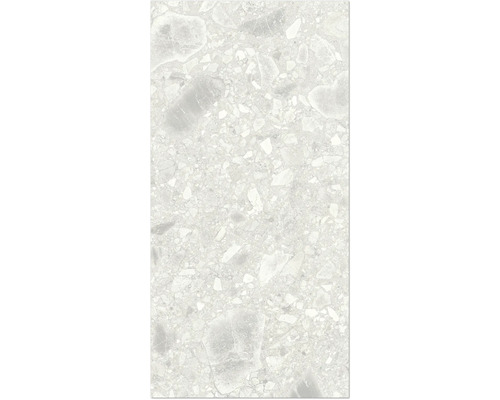 Detaljbild av en golvplatta med terrazzo-utseende