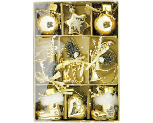 Diverse guldfärgade julgransdekorationer i en förpackning