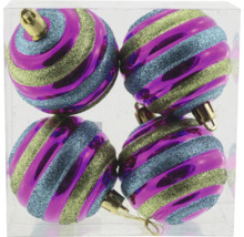 Fyra julgranskulor med randigt mönster i en transparent behållare