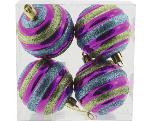 Fyra julgranskulor med randigt mönster i en transparent behållare