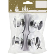 Förpackning med fyra silverfärgade ljusstakar