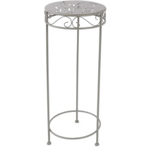 Dekorativ kolonn i metall med växtmönster på bordsskivan