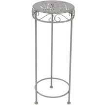 Växtkolonn i metall med mönster på bordsskivan