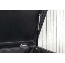 Detaljvy av en öppen förvaringslåda med gasfjäder