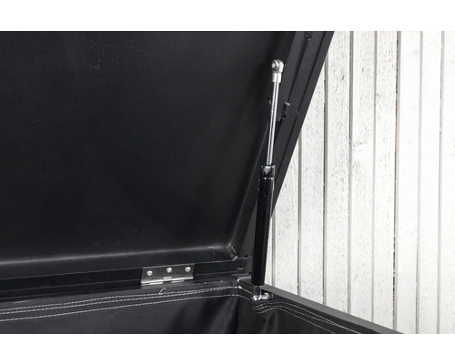 Detaljvy av en öppen förvaringslåda med gasfjäder