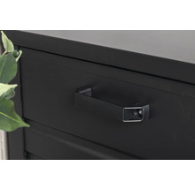 Detaljbild av svart metallskåp med låda och handtag