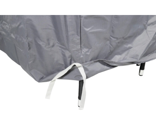 Detaljvy av ett grått skyddshölje för trädgårdsmöbler med fästremmar