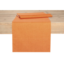 Orange bordslöpare på ett träbord