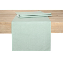 Bordslöpare av tyg på ett träbord