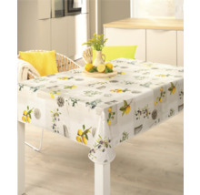 Fyrkantig duk med citron- och olivmotiv på ett matbord.