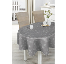 Grått bord med maskrosmönster, dukat med porslin