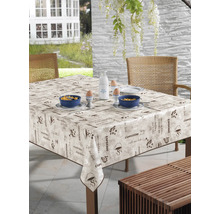 Uteplats med vaxduksduk med kaffemotiv, porslin och frukostingredienser