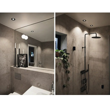 Modernt badrum med dusch, spegel och belysning