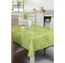 Bordsscen med grön bordsduk i marmordesign på ett bord