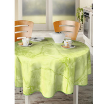 Bordsdekoration med rund bordsduk i marmordesign på ett matbord med porslin och två stolar