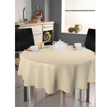 Beige duk på ett runt bord i ett kök med porslin