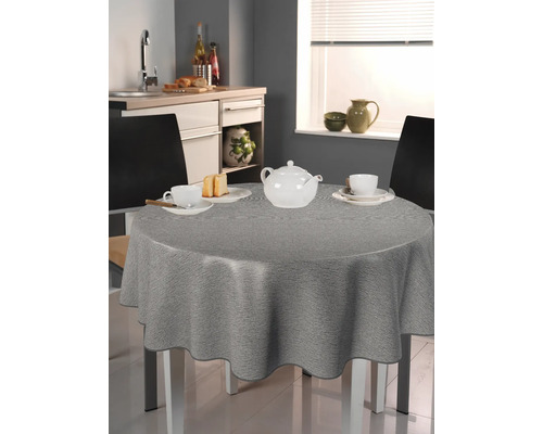 Grå duk på ett runt bord i ett kök
