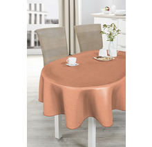 Oval bord med persikofärgad duk, dukat med porslin