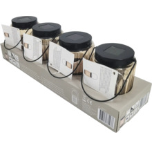 Fyra solcellslampor i glas i förpackning