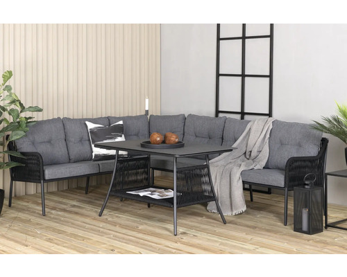 Trädgårdsmöbelset med hörnsoffa, bord med förvaringsutrymme och dekoration på en terrass