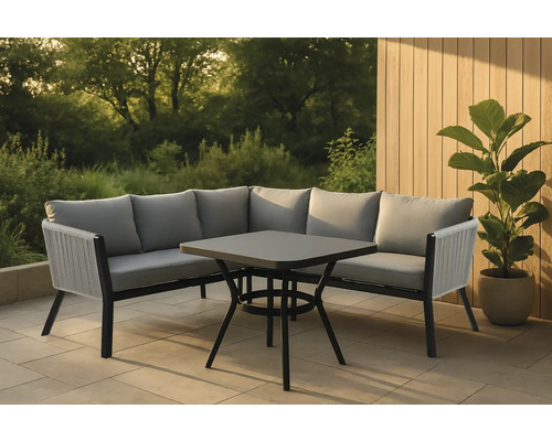 Trädgårdsmöbelset med hörnsoffa och fyrkantigt bord på en terrass.