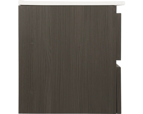 Detaljbild av ett tvättställsskåp med trästruktur