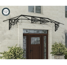 Entrétak av metall med dekorativa ornament ovanför en trädörr på en naturstensvägg, symbol för registrerad design.