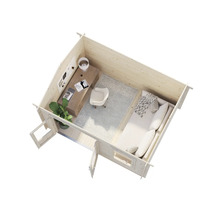 Interiör av ett trädgårdshus i trä med kontorsutrymme och sovplats