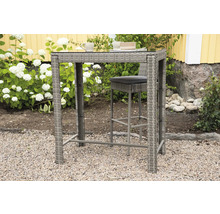 Högt rottingbord med barstol för utomhusbruk på grus