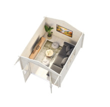 Interiör av ett trädgårdshus med vardagsrum, inklusive soffa, bord och TV