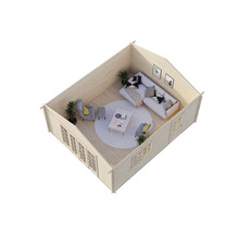 Interiörbild av ett trädgårdshus i trä med möbler