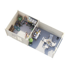 Interiörbild av ett trädgårdshus med grill, trädgårdsredskap och sittgrupp