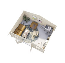 Interiörbild av ett trähus med soffa, bord, matta och arbetsplats.