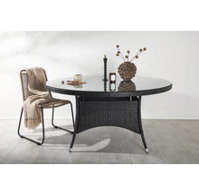 Runt trädgårdsbord med glasskiva och rottingram med stol