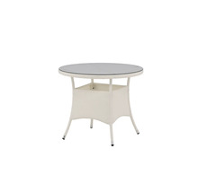 Runt trädgårdsbord med glasskiva och rottingram