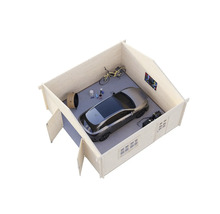 Vy över ett trädgårdsskjul med bil, cykel och verktyg