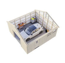 Garage med bil, verktygsvagnar och hyllor