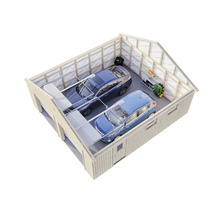 Garage med två bilar, hyllor och trädgårdsredskap