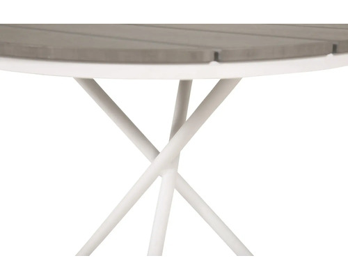 Detaljvy av ett trädgårdsbord med en rund bordsskiva och en filigran metallram