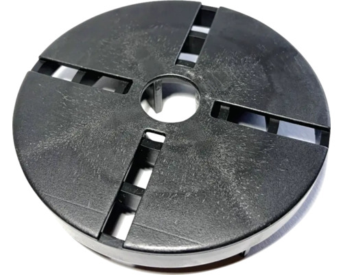 Rund täckplatta med central öppning och fyra spår