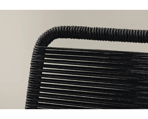 Detalj av en svart repstol.