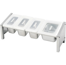 Krydddispenser med fyra behållare och lock